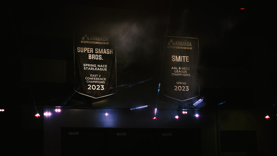 Two large Full Sail Armada branded championship banners hang in the Fortress behind a cloud of smoke.